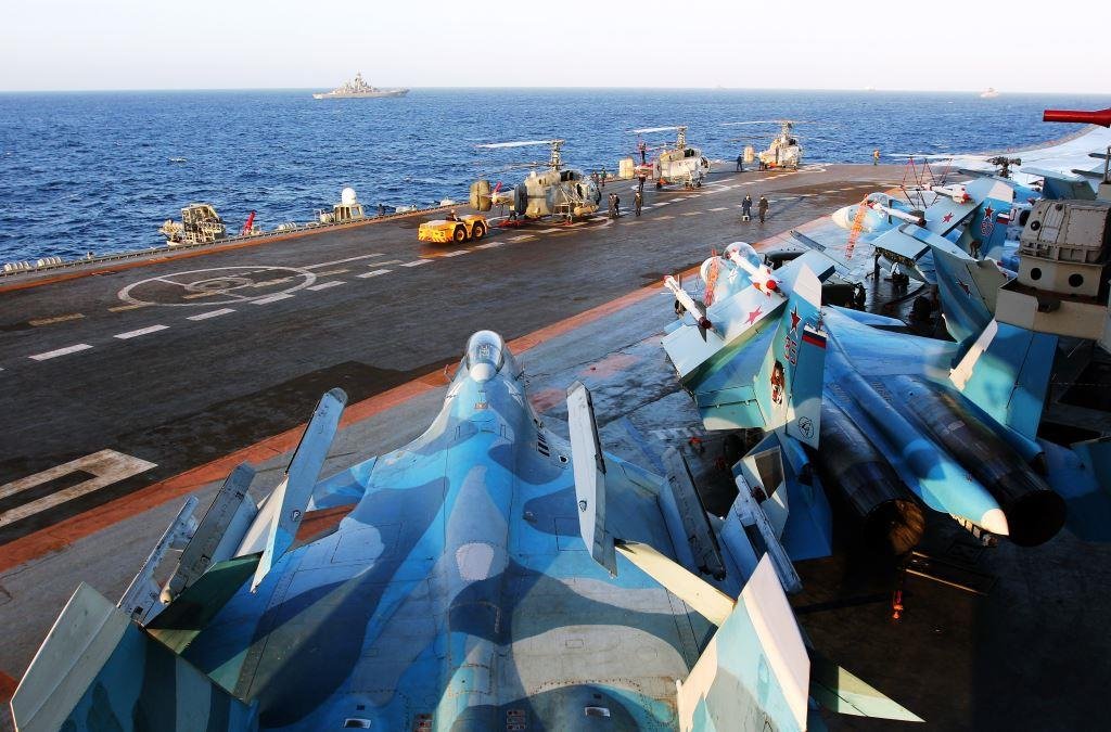 Fighter jet and Helicopters Stand on Admiral Kuznetsov Aircraft Carrier